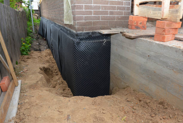 SJ Waterproofing Pros technician performing targeted Waterproofing assessment in Flat Rock, OH